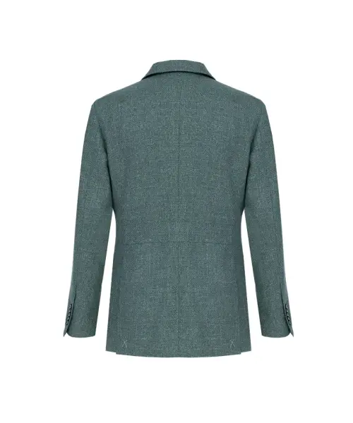 Veste vert chiné sur fond blanc, col tailleur classique, fermeture un bouton, poches plaquées, poche poitrine, silhouette droite et structurée.